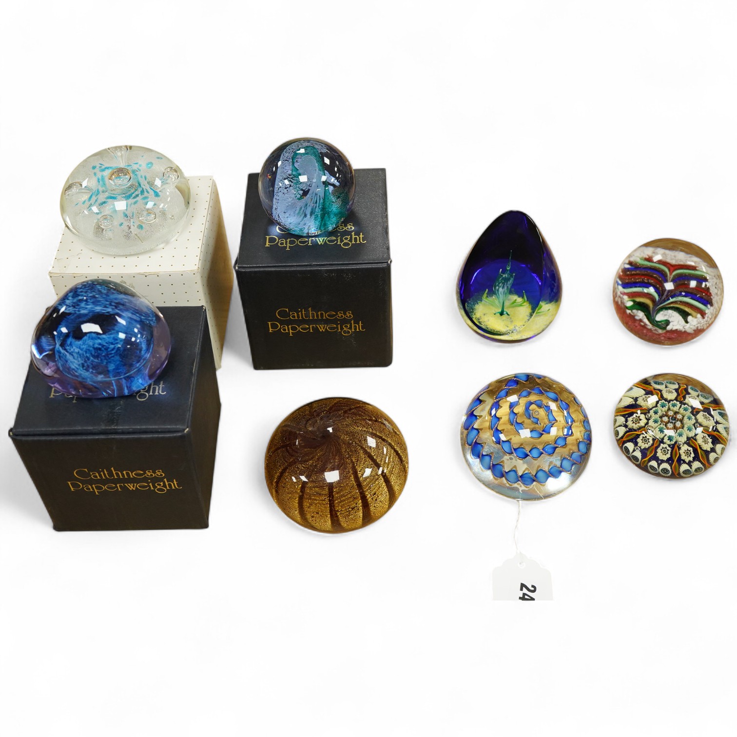 Eight various glass paperweights including Caithness